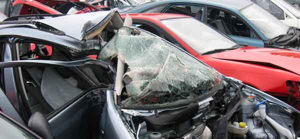 A selection of cars at a scrap yard